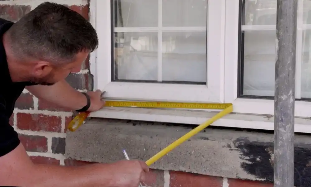 Someone measuring window section